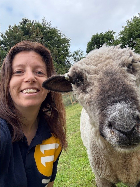 Tenancy Sustainment Specialist Kirsty Hyams with one of the sheep at Wild Mind Wellbeing